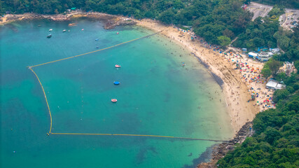 May 1 2025 Secluded Beach with Boats and Dense Forest Surrounding