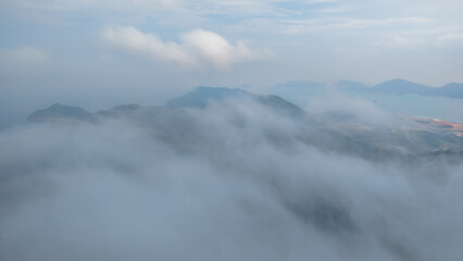 View of Hills Covered in Mist Overlooking the Coastal Landscape