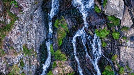 View of a Serene Waterfall Cascading Through Lush Green Forest