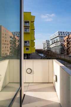 View of colorful modern buildings from inside a bright apartment in Copenhagen. Architectural copy space, urban symmetry and sunlight.
