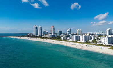 Obraz premium Miami Beach skyline aerial view. Miami city from drone. Tropical Miami scene. Miami district sky view. Famous oceanfront. Panoramic coastline. South beach panorama view. Aerial coastline.
