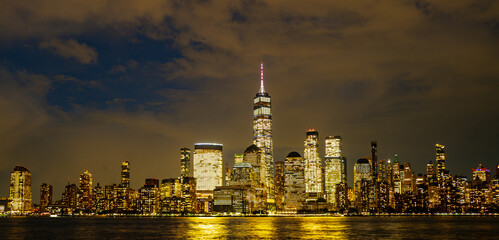 Manhattan skyscrapers at dusk. NY cityscape with lights. Night in New York. NYC night cityscape....