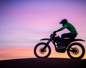 Fototapeta premium Silhouetted dirt biker rides at sunset, motion blur suggesting speed across sandy landscape