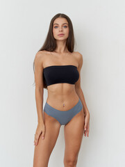 Fototapeta premium Elegance in simplicity with a modern model showcasing fashion in a studio setting