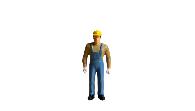a construction worker in uniform standing isolated. the figure wears a yellow helmet - Powered by Adobe