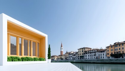 Fototapeta premium Modern minimalist structure with wood accents situated by a river overlooks a historic cityscape under a clear sky
