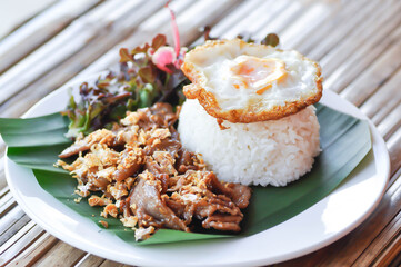 stir fried pork with garlic , pork and rice or deep fried pork or fried pork with rice and sunny side up egg or fried egg