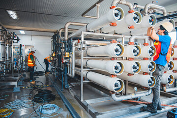 Male worker install is using Industrial oxygen tanks in chemical factory. Oxygen storage vessels, which is either held under pressure in gas cylinders, or as liquid oxygen