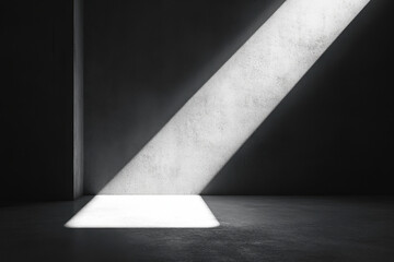 White light shines through a window into a dark room.