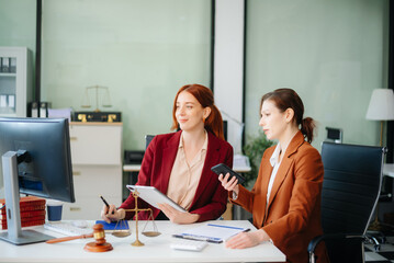 business people and lawyers discussing contract papers sitting at the table. Concepts of law, advice, legal services.