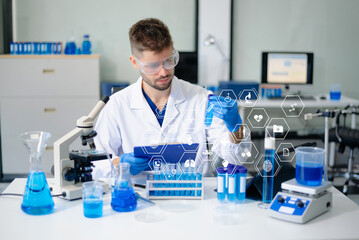 male scientist working with micro pipettes analyzing biochemical samples, advanced science chemical...
