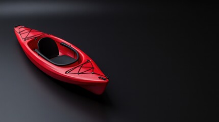 A red kayak isolated on a black background, ready for water activities