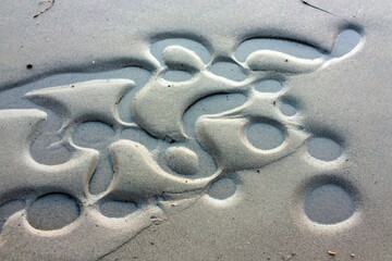 A perfect abstract pattern of sea sand formed after the tide