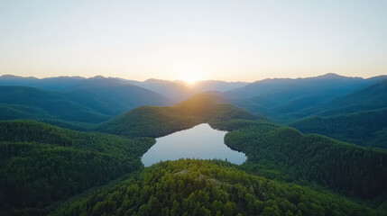 Fototapeta premium Breathtaking mountain landscape with serene lake reflecting soft golden light at sunrise
