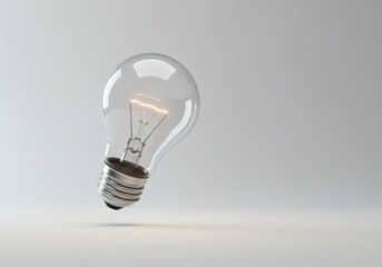 A clear light bulb floating against a soft background, symbolizing innovation, ideas, and modern technology