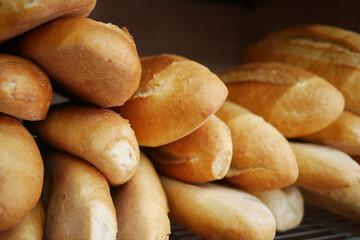 Freshly baked bread rolls displayed in a bakery