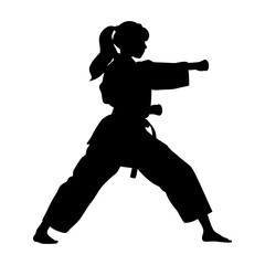 Silhouette of female karate martial artist executing a punch