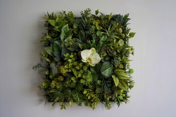 A photograph of a square panel densely covered in artificial foliage