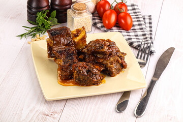 Prepared tasty beef ribs with sauce