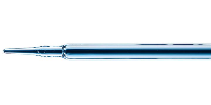 A slender glass pipette with a tapered tip used for precise liquid measurement and transfer.