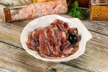 Canned anchovy with oil in the bowl