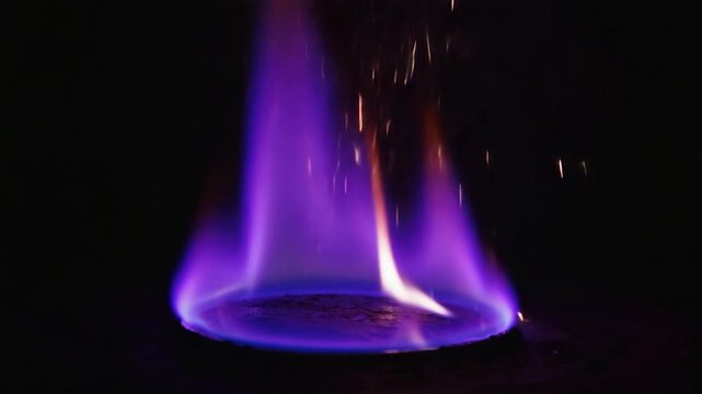 Close-up purple flame on dark background