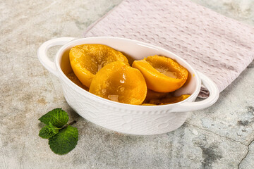 Canned marinated peach in syrop