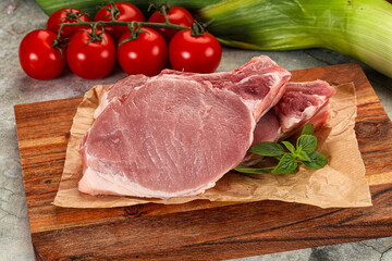 Raw pork steak loin with bone