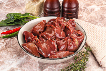 Raw uncokked chicken liver in the bowl