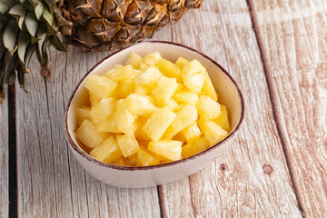Sweet canned pineapple fruit pieces