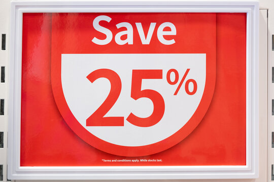 Bold promotional sign featuring save 25% with vibrant red background for advertising purposes