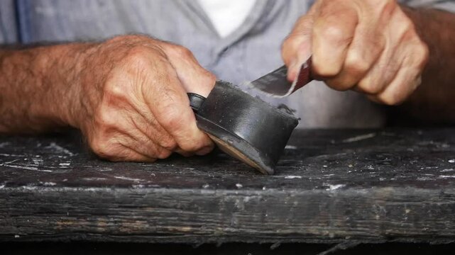 Shoe repair by a craftsman