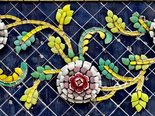 Colorful Floral Design on Blue Tile Background