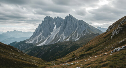 Fototapeta premium Majestic Mountain Range Under Cloudy Sky in Dolomites Region