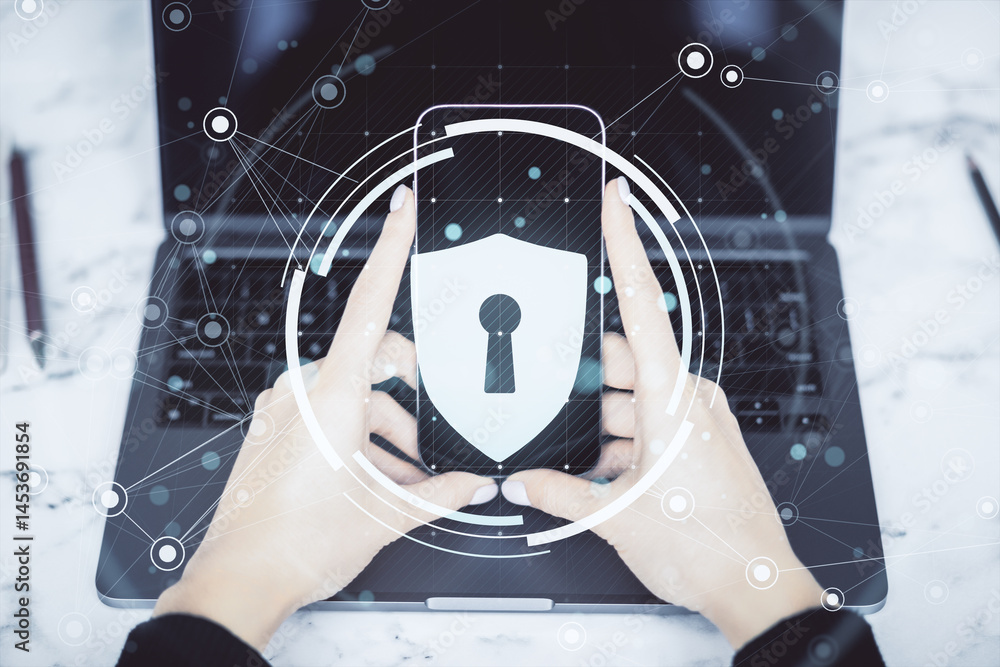 Poster person holding smartphone with digital lock icon over laptop, representing data security and cyberse