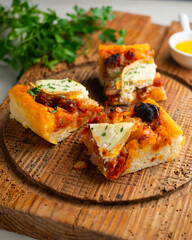 Mallorcan coca with sobrasada, goat cheese, and honey. A traditional recipe from the Balearic Islands.
