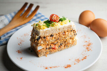 Cold tuna pie with vegetables and sliced ​​bread. A traditional cold pie recipe for summer.