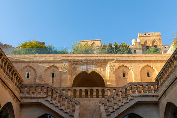 Fototapeta premium Ancient and stone houses of Old Mardin (Eski Mardin) with Mardin Castle, Located South Eastern of Turkey