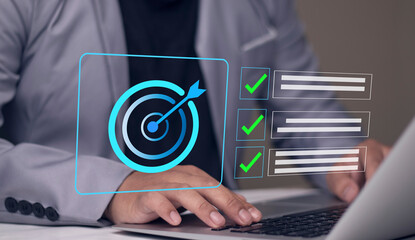 Business goal setting and task management. Businessman interacts with a digital checklist and target icon, representing productivity, goal achievement, and strategic planning.
