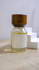 pefume bottle mockup with plain white label on the wooden table background
