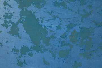 Blue concrete wall with old shabby coating. Smooth stone floor with remains of old blue paint....