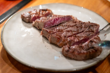 Medium rare wagyu sirloin meat served on plate