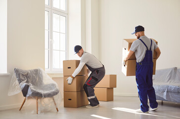 Delivery service men carrying, shipping specialists for transporting, cardboard boxes, movers...