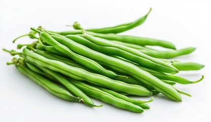 Fototapeta premium Fresh green beans stacked on a white surface ready for preparation or cooking in a kitchen setting