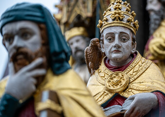 Nuremberg, Germany, August 2, 2023. Detail of one of the many statues that characterize the golden fountain in the market square. Travel destinations and tourist attractions.