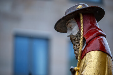 Nuremberg, Germany, August 2, 2023. Detail of one of the many statues that characterize the golden fountain in the market square. Travel destinations and tourist attractions.