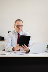 Email notification concept, Male use smartphone and laptop receive message alert in the mailbox.