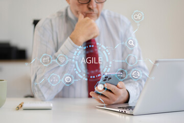 Agile development methodology concept. Business hand using laptop computer and tablet with virtual...