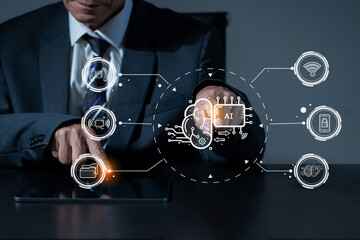 Businessman using a smartphone and laptop computer chatting with an intelligent artificial intelligence.