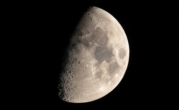 Detailed lunar surface of crescent moon at night